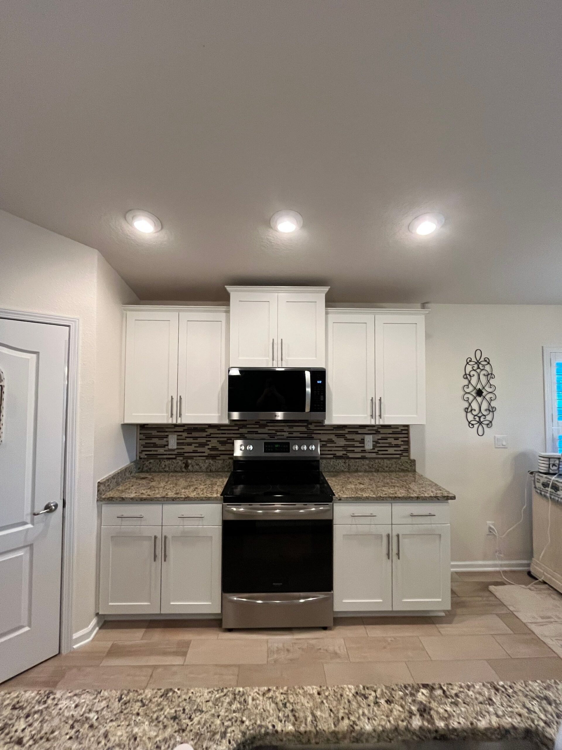 cabinet refacing Jacksonville kitchen cabinets with new doors and hardware, modern white finish and clean lines