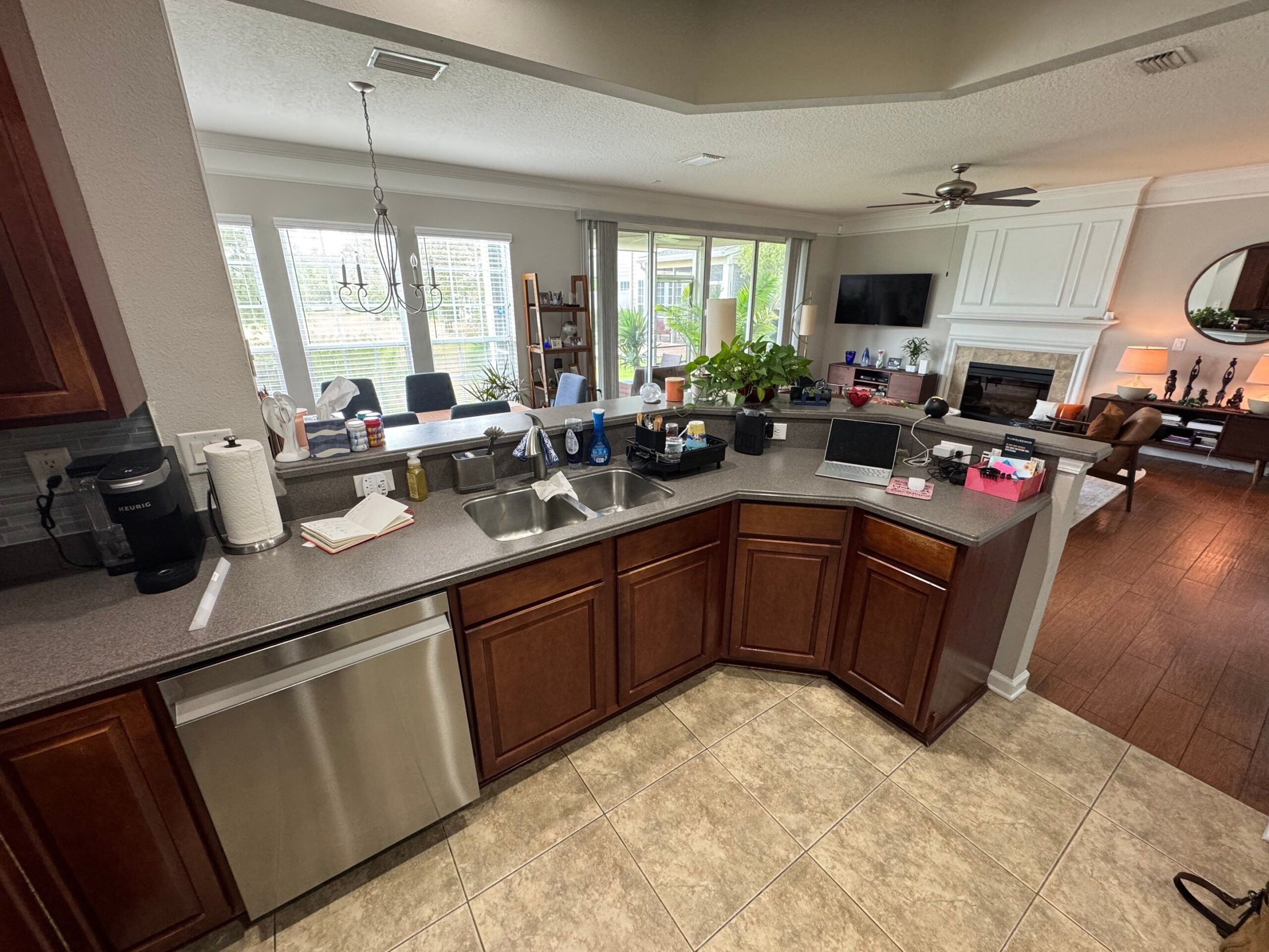 2-Sep 09 2025 03_12pm-dfB6 cabinet refacing Jacksonville kitchen with white shaker cabinets, stainless appliances, and gray tile backsplash